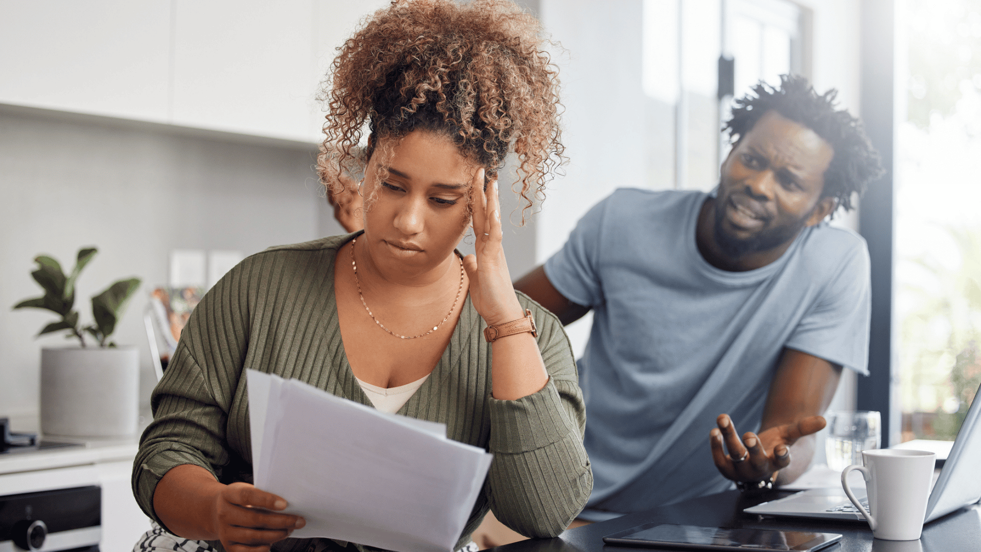Debt-Movement-couple-having-an-argument-while-going-over-their-finances-iStock-1326288977-credit-Credit-PeopleImages.compressed